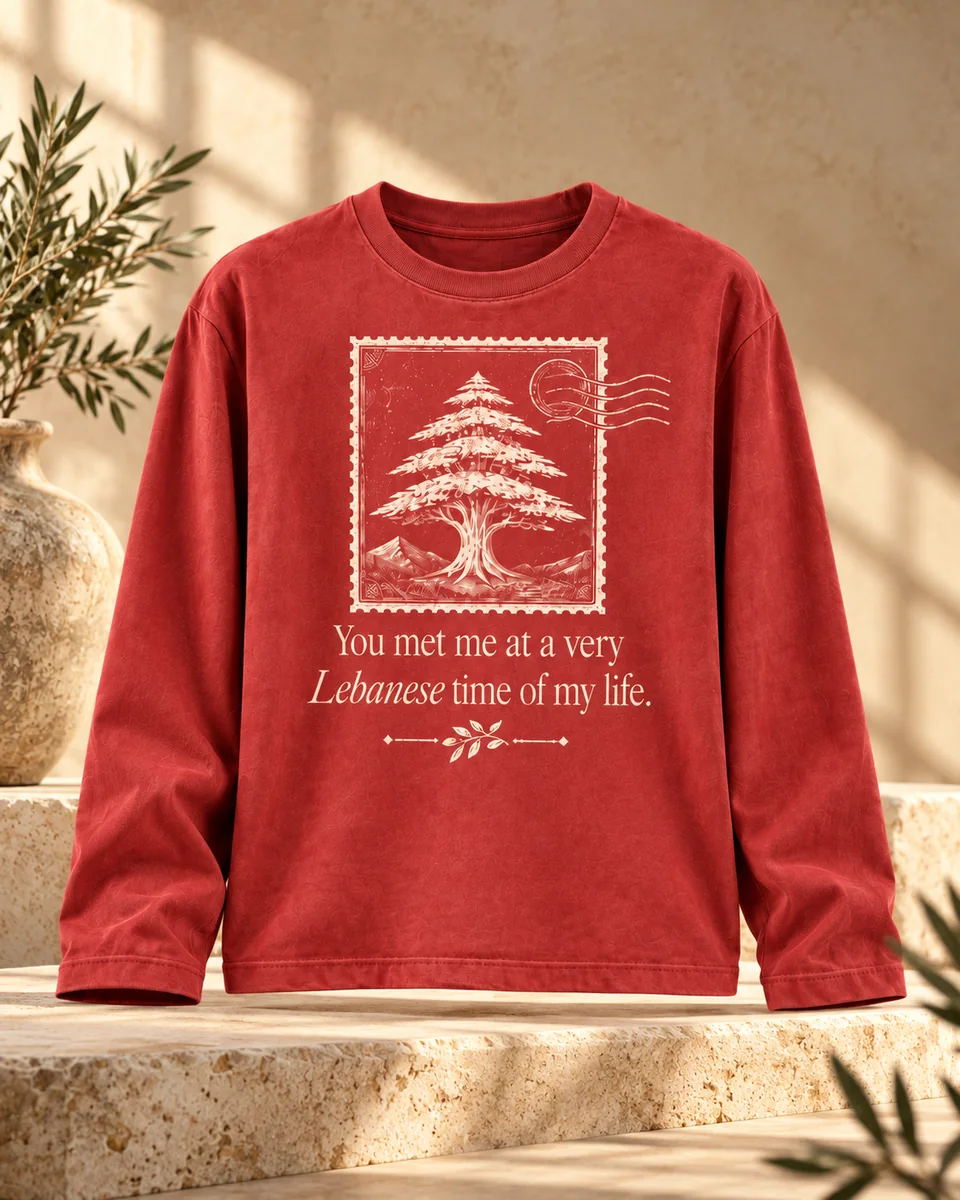 Front of the Beirut Kin washed red long sleeve with cedar postage-stamp artwork